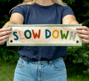 slow down embroidered banner