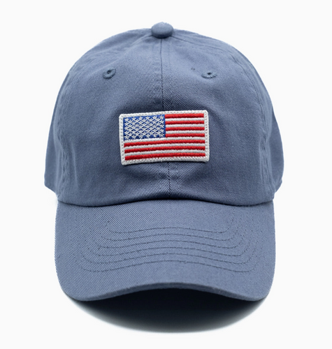 flag patch hat on dusty blue