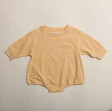 pocket romper in butter