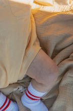 pocket romper in butter