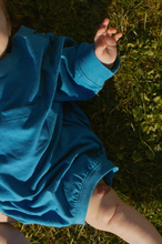pocket romper in lake blue