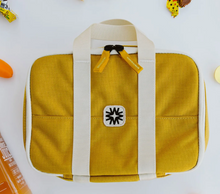the lunchbox in yellow