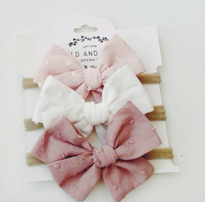 petite pinwheel headband bows in pink