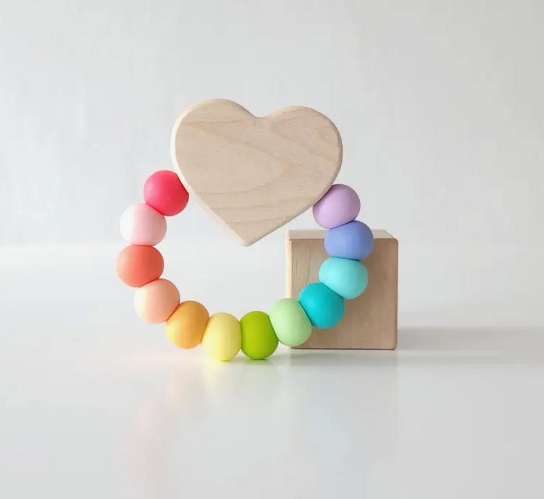 heart teether toy in confetti
